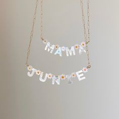 Say my name, say my name! LOVE! These Mother of Pearl letters are such a fun way to add something cute and NEW to your jewelry collection. Perfect for spring and summer! Add daisies for even more fun, or keep it more minimal with the gold bars. Gorgeous mother of pearl initial charm necklace can be personalize with up to 5 letters to create your custom name necklace. Gold-filled is the closest alternative to solid gold. Gold filled jewelry has a thick layer of solid gold bonded onto the base lay Customizable Playful Everyday Jewelry, Playful Personalized Jewelry, Playful Personalized Jewelry For Everyday, Personalized Playful Jewelry For Everyday, Playful White Custom Name Jewelry, Fun Personalized Everyday Jewelry, Personalized Fun Everyday Jewelry, Customizable Playful Jewelry For Mother's Day, Playful Customizable Jewelry For Mother's Day