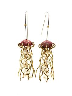 These playful handcrafted jellyfish earrings are perfect whimsical everyday or special occasion wear. Sterling Silver earwires make these comfortable to wear, and ideal for gifting! Contact us with any questions about this piece or custom pieces at alimorse.jewelry@gmail.com.  Process video: https://www.instagram.com/reel/CekHs8TprSz/ Adjustable Wire Wrapped Whimsical Earrings, Whimsical Adjustable Wire Wrapped Earrings, Whimsical Wire Wrapped Earrings For Party, Jellyfish Earrings, Red Copper, Jellyfish, Pearl White, Occasion Wear, Jewelry Earrings Dangle