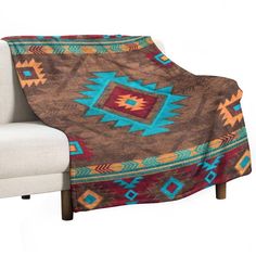 a couch with a blanket on top of it