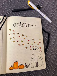 an open notebook with the word october written on it