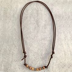 "Adjustable slide knot brown leather necklace with wood and antique silver plated pewter beads. Shown at 18\", and opens to approximately 31\"" Brown Leather Necklace, Vero Beach Fl, Vero Beach, Leather Necklace, Antique Silver, Necklace Etsy, Silver Plate, Brown Leather, Silver Plated