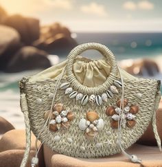 This elegant beach handbag is perfect for an outfit or to go out for dinner. You will get many compliments.  Great for gift giving  It is 100% handmade. Straw material Comes with a removable chain. Size  Bag Length:13 inch, Bag Width:3.1 inch, Bag Height:8.3 inch, Handle Height:3.9 inch, Strap Length:47.2 Summer Woven Sand-colored Shoulder Bag, Spring Beach Sand-colored Straw Bag, Sand-colored Straw Bag For Summer Beach, Bohemian Handheld Straw Bag With Large Capacity, Summer Beach Bags Made Of Shell, Handheld Natural Shoulder Bag For Beach Season, Natural Handheld Shoulder Bag For Beach Season, Beachy Sand-colored Straw Bag, Summer Beach Shoulder Bag Made From Palm Leaf