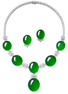 Comprising: a necklace, composed of six highly translucent oval jadeite cabochons of intense emerald green colour, decorated with brilliant-cut and oval diamonds; and a pair of earrings en suite, set with two oval jadeite cabochons; all mounted in 18 karat white gold, necklace length approximately 445mm, earrings with post and hinged back fittings. Necklace jadeite approximately 28.01 x 25.81 x 12.60mm; earrings jadeite approximately 22.20 x 18.87 x 9.96mm. Emerald Green Colour, Beads Mala, White Gold Necklace, Jade Necklace, A Necklace, Jade Stone, Green Colour, Mala Beads, Oval Diamond