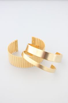 18k gold plated brass cuff. 1/4 inch wide. Gold Cuff Bracelet, Tarnish Resistant For Formal Occasions, Gold Tarnish Resistant Cuff Bracelet For Formal Occasions, Gold Tarnish-resistant Cuff Bracelet For Formal Occasions, Formal Gold Plated Tarnish Resistant Cuff Bracelet, Formal Tarnish Resistant Gold Plated Cuff Bracelet, Luxury Yellow Gold Metal Cuff Bracelet, Gold Cuff Bracelet Jubilee Style For Formal Occasions, Gold Cuff Bracelet With Jubilee Design For Formal Events, Gold Cuff Bracelet With Jubilee Detail For Formal Events