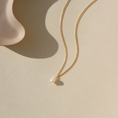 Featuring a delicate pearl and classic gold chain. Wedding Jewelry. Classic and Modern. Sterling Silver or 14k Gold Fill. Token Jewelry, handmade, hypoallergenic and waterproof. Wedding Charm Necklace With Delicate 14k Gold Filled Chain, Dainty Everyday Pearl Chain Necklace, Everyday Yellow Gold Charm Necklace With Pearl Pendant, Dainty Pearl Drop Chain Necklace For Everyday, Feminine Pearl Necklace With Delicate Chain, Everyday Delicate Pearl Chain Necklace, Everyday 14k Gold-filled Pearl Charm Necklaces, Delicate 14k Gold Filled Charm Necklaces With Pearl Pendant, Delicate 14k Gold-filled Charm Necklace With Pearl Pendant