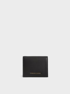 Timeless and practical, this minimalistic black wallet is perfect if you are looking for a no-fuss option. When open, the wallet offers a spacious inner compartment, while its compact design makes it easy to fit into bags of all sizes and back pockets too. Use the zip-around design to keep your belongings safe and secure. Black Daisy, Short Wallet, Black Wallet, Charles Keith, Small Wallet, Compact Design, Calf Leather, Wallet, Leather