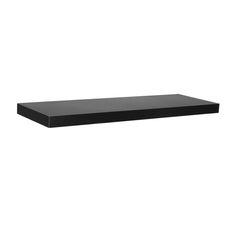 a black shelf sitting on top of a white wall