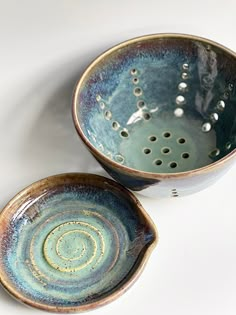 two bowls sitting next to each other on a table