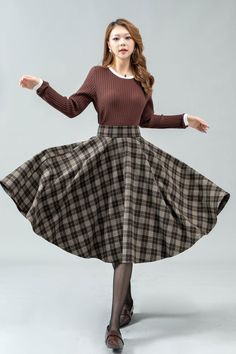 ★★ Welcome to my Ylistyle's shop！！！ This midi plaid high waist circle wool skirt looks simple and elegant.  Our tartan skirt can well show your elegant temperament and taste.   Made of high-quality fabric, giving you a good touch and very comfortable to wear. ★★FEATURES 25% wool, other fiber,nylon Polyester lining Two Side pockets Back zipper closure Midi skirt Wool circle skirt Tartan skirt Party skirt Autumn winter wool skirt Dry clean ★★ The model's height approx 170 cm (5′ 7″) with the 84 cm Retro Winter Skirt, Plaid Lined Skirt For Winter, Plaid Midi Skirt For Fall, Relaxed Full Plaid Skirt, Brown Full Skirt Bottoms For Winter, Winter Retro Knee-length Skirt, Brown Full Skirt For Winter, Retro Knee-length Winter Skirt, Plaid Flared Skirt