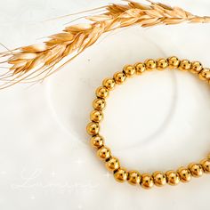 Our Daisy Bead Bracelets are amazing for stacking, adding a splash of charm to any look. They are elastic so they effortlessly fit all wrist sizes, making them a perfect blend of style and versatility. Material: 18k gold plated on stainless steel Size: 3mm-6mm Care: Water-resistant, tarnish-free, hypoallergenic, nickel and lead free Trendy Gold Stretch Bracelet, Hypoallergenic, Trendy Gold Stackable Stretch Bracelet, Trendy Gold Stretch Bracelet For Everyday, Gold Trendy Stretch Bracelet With Spacer Beads, Trendy Gold Stretch Bracelet With Spacer Beads, Trendy Gold Bracelets With Round Beads, Trendy Gold Stretch Bracelet With Beads, Trendy Gold Stretch Bangle Bracelet, Minimalist Gold Stretch Bracelet, Hypoallergenic