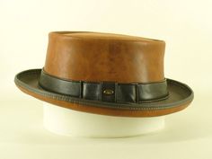 Tan Kangaroo Leather Pork Pie Hat    Hand crafted by John Whittaker (leather craftsman since 1972), of Cobb & Co Hats & Accessories in Melbourne, Australia. We create a wide range of formal & casual hats - check out our ebay store for more great hats & accessories!   The tan kangaroo leather Pork Pie Hat: *       Perfect for band gigs/formal events *       Made from top quality, genuine tan leather *       Made to stay in great shape, even with lots of handling & wear *       Brim is reinforced Black Leather Hat, Pork Pie Hat, Leather Craftsmen, Pork Pie, Leather Hats, Casual Hat, Hat Band, Air Mail, Etsy Australia