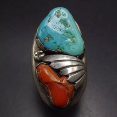 SIGNED VINTAGE ZUNI TURQUOISE and CORAL HEAVY STERLING SILVER RING  DESCRIPTION:  This tremendous ring will be a treasured addition to your collection of fine vintage Southwestern and Native American jewelry. MEASUREMENTS:  Ring face measures 1 5/8" x 7/8" RING SIZE: 10 WEIGHT:  51.4 grams SIGNED:  L.T. Zuni STERLING:  unmarked, verified sterling silver Vintage Multi-stone Collectible Rings, Vintage Multicolor Multi-stone Turquoise Ring, Multicolor Handmade Vintage Ring, Handmade Multicolor Vintage Ring, Handmade Vintage Multicolor Rings, Vintage Untreated Collectible Rings, Untreated Vintage Collectible Rings, Jewelry Measurements, Turquoise And Coral