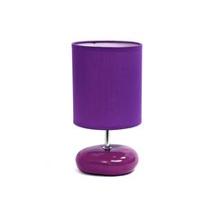 a purple lamp on a white background