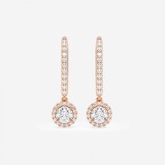 Drop it like it's hot with these sizzling round halo drop earrings made with our finest lab grown diamonds. Each large round diamond is encircled with smaller star-like diamonds to give this beautiful halo effect. Made with lever back posts that slip on easily and securely. It can't get hotter than this! Rose Gold Diamond Earrings With Halo, Rose Gold Halo Earrings With Cubic Zirconia, Rose Gold Diamond Halo Earrings, Rose Gold Halo Setting Cubic Zirconia Earrings, Round Rose Gold Earrings With Halo Setting, Rose Gold Cubic Zirconia Earrings With Halo Setting, Formal Rose Gold Halo Diamond Earrings, Rose Gold Round Diamond Earrings With Halo Design, Rose Gold Round Halo Diamond Earrings