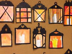 paper lanterns are hanging on a bulletin board