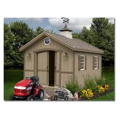 a red tractor parked in front of a small shed with a cupola on top