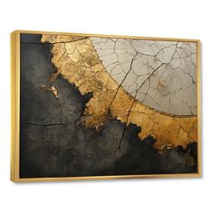 an abstract painting with gold and black paint on the wall above it is a large piece of wood that has been cut in half