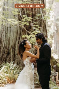 a man and woman standing next to each other in front of a tree with the caption's name on it