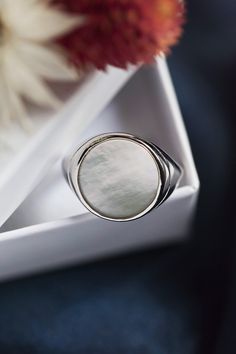 RING IN SILVER 925 AND ROUND MOTHER-OF-PEARL Large ladies ring in 925 silver and mother-of-pearl. An imposing and very chic ring for women in 925 silver and its round and flat mother-of-pearl with magnificent reflections. - Material: 925 silver - Stone: Mother of pearl - French made Luxury White Signet Ring With Polished Finish, Elegant Sterling Silver Signet Ring With Polished Finish, Elegant Sterling Silver Open Signet Ring, Elegant White Gold Sterling Silver Signet Ring, Luxury White Gold Moonstone Ring With Polished Finish, Luxury White Moonstone Ring With Polished Finish, White Gold Rings With Shiny Finish For Gift, Luxury White Polished Moonstone Ring, Elegant Sterling Silver Signet Ring For Anniversary