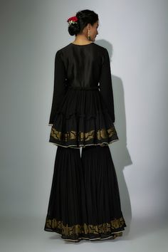 Black peplum anarkali with zardosi and marodi embroidered neckline. Paired with a gharara and embroidered dupatta. - Aza Fashions Anarkali Dress With Sheer Dupatta And Peplum Shape, Festive Ruffled Peplum Lehenga, Traditional Georgette Sets With Ruffles, Anarkali Georgette Palazzo Set With Ruffles, Eid Anarkali Dress With Peplum Shape, Festive Peplum Lehenga With Ruffles, Eid Anarkali Peplum Dress, Elegant Peplum Anarkali Set, Eid Georgette Anarkali Set With Peplum Shape