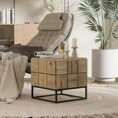 a living room with a chair, ottoman and coffee table in it's center