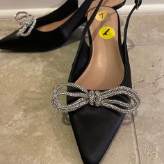 Kitten Heels With Bedazzled Bow At Toe. Luxury Kitten Heels With Bow For Party, Bow Kitten Heels, Black And Silver Bow Heels, Chic Black Kitten Heels With Bow, Black Kitten Heels With 4-inch Heel, Black Kitten Heels, Black Silver, Kitten Heels, Shoes Women Heels