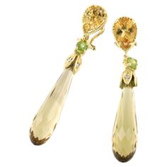 Classical designs with natural stones , suitaible for any occasion. Made in Italy by Stanoppi Jewellery since 1948 Earrings in 18k yellow gold with Wisky Citrine (long drop cut, size: 3,00cm), Citrine (drop cut, size:7x10 mm), Peridot (round cut size: 3,00mm) and white Diamonds cts 0.08 VS colour G/H. All Stanoppi Jewelry is new and has never been previously owned or worn. Each item will arrive at your door beautifully gift wrapped in Stanoppi boxes, put inside an elegant pouch or jewel box. Elegant Pouch, Classic Earrings, Jewel Box, G H, White Diamonds, Diamond White, Citrine, Round Cut, Jewelry Earrings Dangle