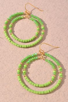 Go out of your way to bring a bit of pizzazz to any look with these Circle Duo Beaded Earrings in a vibrant lime hue. Made with intricately-beaded circles, these lightweight earrings will have you dreaming up all sorts of stylish combinations! (And yes, they'll make 'em lime with envy!) Trendy Green Beaded Dangle Earrings, Trendy Green Beaded Drop Earrings, Green Beaded Dangle Hoop Earrings, Trendy Green Jewelry With Faceted Beads, Trendy Green Beaded Earrings, Trendy Green Hoop Earrings For Beach, Green Trendy Beaded Earrings For Summer, Trendy Green Beaded Earrings For Summer, Green Jewelry With Tiny Beads