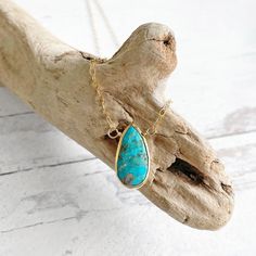 The elegant teardrop pendant is perfect alone or layered! GEMSTONE: Turquoise CHAIN: 18" long 14k gold filled CLOSURE: Lobster clasp *PLEASE NOTE - Due to the one-of-a-kind nature of the stones, exact colors and patterns may vary slightly from the image shown. Gold Teardrop Turquoise Necklace Gift, Gold Turquoise Teardrop Necklace For Gift, Dainty Pendant Necklace, Bezel Necklace, Turquoise Pendant Necklace, Dainty Pendant, Necklace Layering, Teardrop Pendant, Layering Necklace