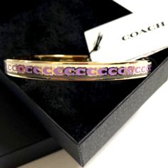 New Coach Women's Bangle Bracelet Plated Color Pink And Gold Coach Metal Bangle Jewelry, Trendy Pink Jewelry For Formal Occasions, Pink Metal Jewelry Fashion Accessory, Pink Metal Jewelry As Fashion Accessory, Coach Formal Bracelet, Coach Silver Bangle Bracelets, Coach Formal Bracelet Jewelry, Coach Silver Bangle Bracelet, Coach Metal Bracelet Jewelry