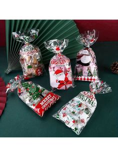 christmas candy wrapped in cellophane and sitting on a table