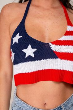 This Red Navy USA Sweater Halter Crop Top features a USA flag design and a sleeveless halter design, perfect for celebrating the 4th of July. Ideal for game day, summer events, or patriotic holidays. Add a touch of pride to any occasion with this top. Fabric & fit: Model is wearing size small. American Flag Print Cotton Top For Beach, Spring Beach Tops With Flag Print, Red Tops For Summer Sports Events, Red Summer Tops For Sports Events, Red Tops For Sports Events In Summer, Summer Game Day Tank Top, Red Tank Top With Flag Print For Summer, Red Flag Print Tank Top For Summer, Summer Tank Top For Sports Events