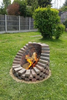 a fire pit in the middle of a yard