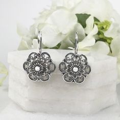 925 Sterling Silver Handmade Artisan Crafted Filigree Flower Earrings   Matching ring is available. https://www.etsy.com/listing/1064044313/daisy-flower-silver-ring925-sterling Material: 925 Solid Sterling Silver, 925 Stamped Earrings Length: 1.20 inches Width: 0.75 inches Finishing: Oxidized and Polished Comes with a gift pouch and box Free Domestic Shipping We hope that you enjoy our exclusive artisan handcrafted jewelry. Artisan Sterling Silver Wedding Earrings, Flower Shaped Oxidized Jewelry As Gift, Traditional Sterling Silver Flower-shaped Earrings, Traditional Sterling Silver Earrings In Flower Shape, Flower Shaped Oxidized Jewelry Gift, Traditional Sterling Silver Flower Shaped Earrings, Ornate White Bridal Earrings As Gift, Traditional Sterling Silver Flower Earrings For Gift, Intricate Flower-shaped Earrings For Gift