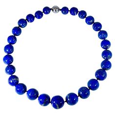 Vintage Lapis Lazuli Single Strand Necklace with 1.1 Carat Diamond Ball Clasp in 14 Karat White Gold This marvelous vintage Lapis Lazuli necklace features 1 row of luscious huge Beads (measuring approximately from 23 MM to 16 MM) . It is a graduating necklace strand is 24 inches long There are 31 Beads of significant large size. 14 karat white gold 9 grams There is a big ball clasp of 16 MM size studded with diamonds. Diamond weight 1.1 ct Very uniform beads , bright color and luster , has golde Diamond Ball, Necklace With Diamond, Necklace Clasp, Lapis Necklace, Lapis Lazuli Necklace, Necklace Clasps, Big Balls, Lapis Lazuli Stone, Cabochon Jewelry