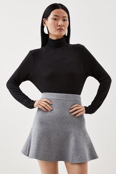 Feel Confident In Our Mini Skirt, Made In Knit Fabric, Featuring An Ultra Minimal Design, With A High Waistline That Flares At The Thighs. Style It With A T-Shirt And Block Heels Or Ankle Boots For A Look Perfect For Days Out, Then Wear It With The Matching Top, Heeled Boots Or Strappy Heels For An Evening Look. Compact Wool Look Knit Flippy Mini Skirt High Quality, Soft Knit Fabric Feminine Flared Silhouette Comfortable High Waistline Matching Top Sold Separately Mini Skirt With Boots, Hiking Skirt, Skirt Jumper, Flared Mini Skirt, Skirts With Boots, Miniskirt Outfits, Bandeau Dress, High Waisted Flares, Gray Skirt