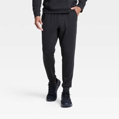 Why we're ALL IN: Mesh spacer joggers with a solid-color finish, double-knit texture, mid rise, full length and banded cuffs. Crafted from a lightweight fabric blend with stretch for comfortable wear that moves with you. Tailored in a regular-fit silhouette. Feature side pockets and a zippered back pocket for stashing go-to essentials, and a drawstring waistband for a customizable fit. All in Motion™: Inspiring the potential in every body. Comfort Stretch Sweatpants With Elastic Waistband For Sportswear, Solid Joggers With Comfort Waistband And Stretch, Solid Color Comfort Stretch Joggers With Comfort Waistband, Sporty Activewear With Tapered Leg And Elastic Cuffs, Sporty Comfort Stretch Solid Color Sweatpants, Solid Color Comfort Stretch Activewear With Tapered Leg, Comfort Stretch Joggers With Ribbed Waistband And Tapered Leg, Black Comfort Stretch Joggers, Solid Joggers With Ribbed Waistband For Workout