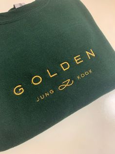 Hi ARMY  FIRST JUNGKOOK ALBUM Celebrate the release of ' Golden' with this comfy sweatshirt.  Currently available in : -Forest (pictured) - Navy - Black - White Size Guide Length/Width::  Small - 27/20 in Medium - 28/22 in Large - 29/24 in XL - 30/26 in This item is MADE TO ORDER and can be shipped out within a week  Colors may vary due to color variations in monitors All of the crewnecks are unisex and made of polyester and cotton material  These crewnecks are machine embroidered with 🫶 SIze up for an oversized fit Please message me if you have questions about your order  All sales are final Green Branded Sweatshirt For Winter, Green Branded Sweatshirt For Fall, Green Branding Sweatshirt For Fall, Green Sweatshirt With Branding For Fall, Jungkook Golden, Easy Diy Clothes, Bts Clothing, Kpop Diy