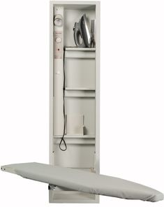 an ironing board is in front of a cabinet