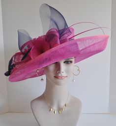 "This beautiful sinamay hat is an elegant wear at any church or derby event. its sinamay material is not too intimidating and attracts the eye. The chic flower adnorment that rests on the wide, side sweep brim is complemented by sinamay accentuations. Material: Sinamay with feathers Crown Width; 8 inch Crown Height: 4 inch Brim Width: 7 ~ 5 inch Head girth is from 22' to 23.5 \" adjustable size fits most with an adjustable cord strap for the smaller fit Color on screen may vary from actual merch Formal High Crown Fascinator For Kentucky Derby, Sinamay Fascinator For Kentucky Derby Races, Kentucky Derby Sinamay Top Hat For Party, Kentucky Derby Party Sinamay Top Hat, Sinamay Hat Fascinator For Kentucky Derby, Curved Brim Sinamay Costume Hat For Party, Formal Sinamay Boater Hat For Royal Ascot, Party Costume Hat With Curved Brim In Sinamay, Sinamay Mini Hats For Royal Ascot Races