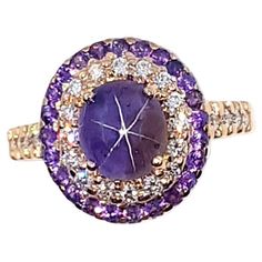 Purple Star Sapphire 2.50 carats, Purple Sapphire 0.59 carat and Diamond 0.36 carat Ring set in 18K Rose Gold Settings Width: 1.2 cm Length: 1.4 cm Ring Size: 53 Total Weight: 6.0 grams "We first opened doors in 1980 when it was then situated in the vicinity of the Victory Monument; a small and modest storefront with a couple of counters. From its humble beginnings to where it stands today, our company has proven its abilities as a jeweler. Since the beginning, we have been supplying fine qualit Purple Star, Diamond Ring Set, Sapphire And Diamond Ring, Purple Sapphire, Star Sapphire, Diamond Ring Settings, Solitaire Ring, 18k Rose Gold, Ring Set