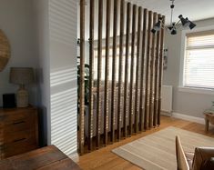 a living room with wooden slats on the wall