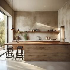 a kitchen with wooden counter tops and stools next to an open door that leads outside