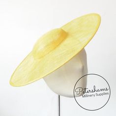 This Yellow cartwheel hat base is a classic shape that has sprung into popularity in the past year. Made from 2 layers of stiffened sinamay, these cartwheels are ready to trim and are fitted with a petersham ribbon on the inside crown edge. Simply add a comb or headband to secure to the head.Hat base measures:Width: 35.5cm (14 inches)Crown Width: 13.5cm (5.3 inches)Crown Height: Approximately 3.5cm (1.7 inches)For even more millinery supplies you can find us here:www.etsy.com/shop/PetershamsAll Fitted Hat With Round Crown For Kentucky Derby, Adjustable Curved Brim Boater Hat For Church, Classic Fascinator Hat, Yellow Adjustable Fascinator Hat, Classic Fitted Fascinator With Wide Brim, Classic Fitted Fascinator Hat, Fitted Brimmed Straw Hat For Church, Adjustable Hat With Round Crown For Summer, Yellow Short Brim Fascinator For Church