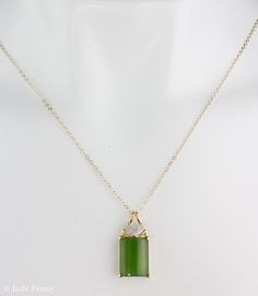 "Here is a AAA grade Siberian emerald green nephrite jade set in solid 18KT yellow gold and accented with round full cut white diamonds. This pendant is designed with a chevron accent. It is modern with simple clean lines. The jade is natural and untreated. This nephrite jade has a beautiful glowing apple green color. Stone & Dimensions: Natural Untreated gem grade AAA Siberian Emerald Green Nephrite Jade: approximately 11.2 carats 16mm long x 12mm wide x 5mm thick, Overall size of pendant: Elegant Rectangular Jade Necklace, Elegant Green Rectangular Emerald Necklace, Formal Rectangular Jade Jewelry, Formal Jade Jewelry For May Birthstone, Green Rectangular Stone Jewelry For Formal Occasions, Formal Green Jewelry With Rectangular Stone, Green Rectangular Necklace For Formal Occasions, Formal Green Rectangular Necklace, Rectangular Green Jade Jewelry