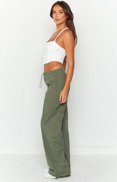 * Khaki Drawcord Cargo Pants 
 * You're sure to be serving looks in these khaki green drawstring cargo pants (). Styled with a crop () and sneakers makes the ultimate effortless and trendy fit! 
 * 
 
 * Cargo style 
 * Drawcord features 
 * Pockets on both sides 
 * Drawcord pocket on one side halfway down leg 
 * Drawcord at bottom hem 
 * Unlined 
 * Mid weight material with no stretch Cargo Pants Styled, Drawstring Cargo Pants, Prom Midi Dress, Shop Pants, 60's Dress, Trendy Fits, Summer Playsuit, Cargo Style, Beginning Boutique