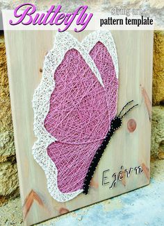 a wooden plaque with a pink heart on it and the words butterfly written in black