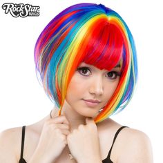 This dramatic, wedge-shaped bob is a popular style among fashionistas! Short in the back and long in the front, it comes with longer bangs, leaving you with endless styling opportunities!   Model: Mynx Midnight Can take heat up to 360 degrees Adjustable Weft Unisex Washable Langer Pony, Rainbow Wig, Rainbow Rocks, Wig Party, Halloween Costume Shop, Long Bangs, Short Bob Wigs, Colored Hair, Bob Wig