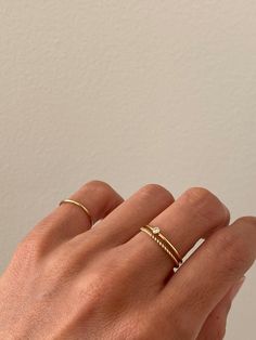 This dainty stacking ring is the perfect everyday ring. It's made of high quality gold-filled wire, making it hypoallergenic and perfect for sensitive skin. Wear this delicate ring alone or stack it with other rings.Details- Made of 1mm gold filled wire- Available in sizes 2 - 8- Custom size available - We make it in 14k solid gold Shop the look- Dainty Solitaire Ring- Dainty Twist Ring Feminine Rings Aesthetic, Ring Stack Minimalist, Simple Gold Jewelry Rings, Simple Stackable Rings, Mejuri Rings Stacking, Simple Layered Rings, Everyday Gold Rings For Women, Stack Gold Rings, Gold Rings Delicate