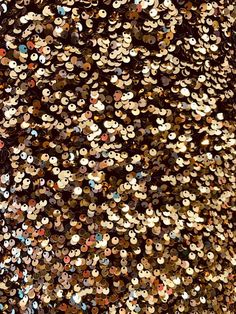 a large amount of sequins on a black background